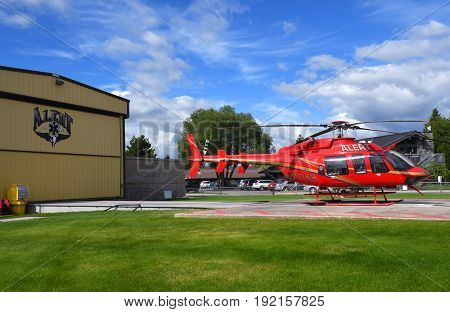 KALISPELL, MONTANA, USA - June 19, 2017: ALERT air ambulance helicopter on the helipad at Kalispell Regional Medical Center.
