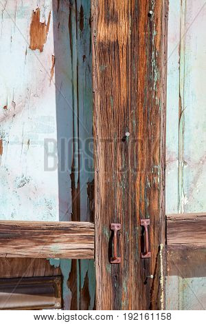 Weathered Old Abandoned Painted Door Rusty Handles