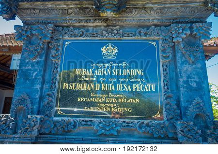 BALI, INDONESIA - MARCH 08, 2017: Informative sign on a black cement of Subak Abian Selonding, Bali, Indonesia.