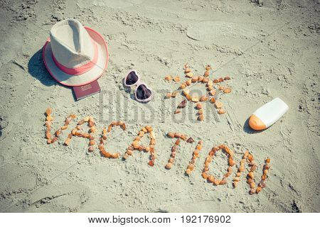 Word Vacation, Accessories For Sunbathing And Passport At Beach, Concept Of Travel In Summer Time