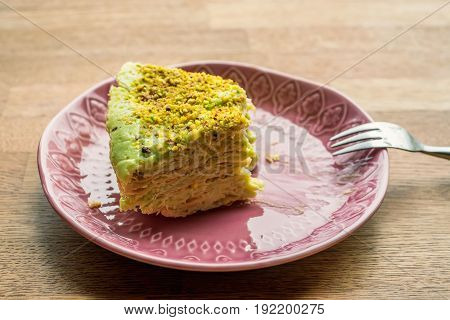 Close up unfinished piece of layer cake on plate moderate diest concept