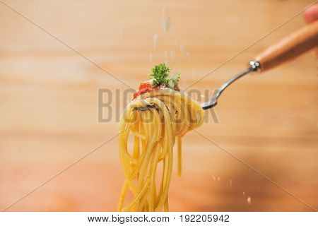Close-up of asta spaghetti with tomato sauce olives and garnish. Italian food.