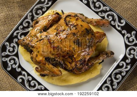 Little Chicken Dish With Polenta On Wood Background