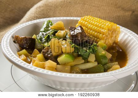 South American Cuisine: Puchero Soup With Chickpeas Close-up In A Pot On The Table.