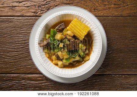 South American Cuisine: Puchero Soup With Chickpeas Close-up In A Pot On The Table.