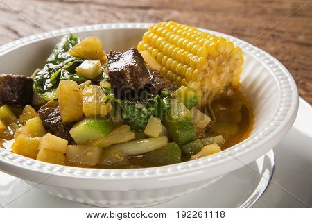 South American Cuisine: Puchero Soup With Chickpeas Close-up In A Pot On The Table.