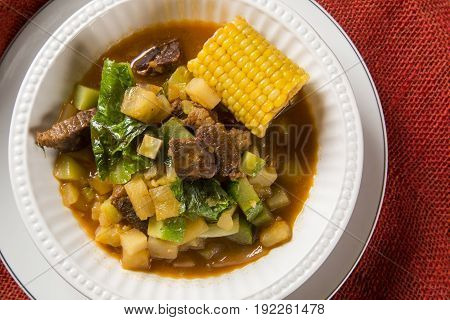 South American Cuisine: Puchero Soup With Chickpeas Close-up In A Pot On The Table.