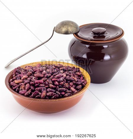 The Composition Of The Red Beans In A Clay Pial Next To A Clay Pot And A Copper Spoon,