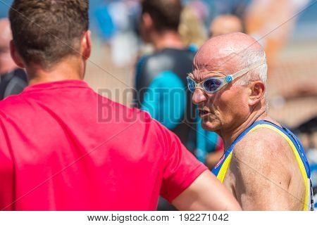 Kijkduin The Hague the Netherlands - 17 June 2017: Kijkduin cross triathlon senior participant about to do swim leg
