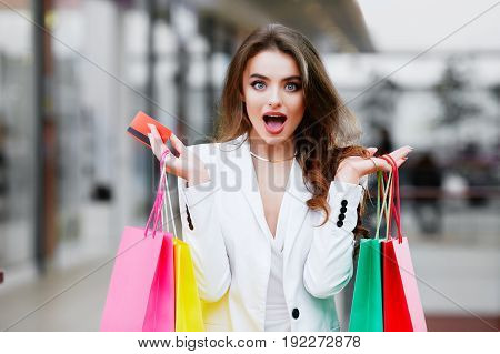 Surprised Woman Purchasing By Credit Card