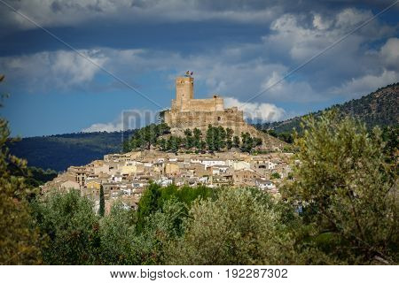 Top of the hill with Biar castle and very hot day with mist in the air