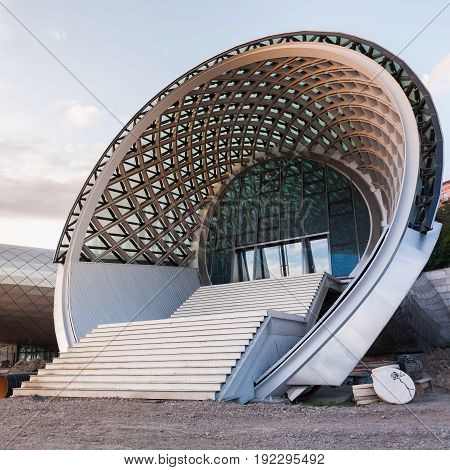 Tbilisi, Georgia - May 4, 2014: Beautiful view Of Concert Music Theatre Exhibition Hall In Summer Rike Park on the Sunset, Tbilisi, Georgia. Beautiful new park in the city center.