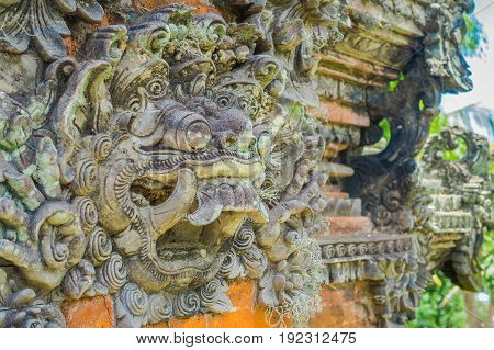 BALI, INDONESIA - MARCH 05, 2017: Stoned statue in the enter of Pura Ulun Danu Bratan temple on Bali island, Indonesia.