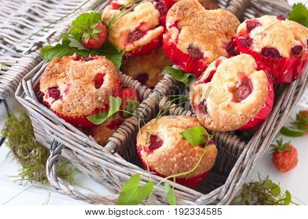 Fresh homemade delicious berry muffins in a picknick basket