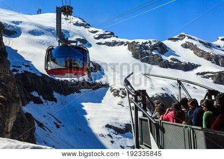 Mt. Titlis Switzerland - May 28 2017: a gondola of the Rotair cable car view from the station on the top of the mountain. Rotair gondolas make a 360 degrees turn during.