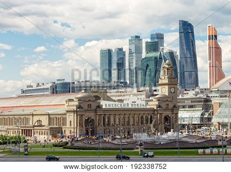 MOSCOW RUSSIA - JUNE 6 2017: Kiev railway station Europe Square with skyscrapers international business center "Moscow-city" in the background