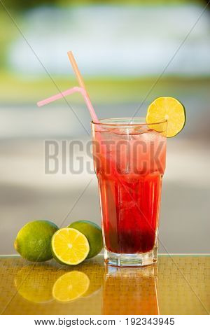Non-alcoholic drink and fruit on a table with a blurred background.
