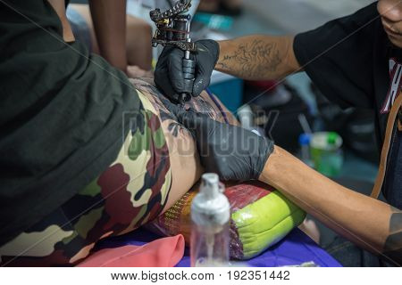 Tattoo Artist Drawing Art On Body