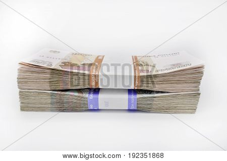 really two packs of 100 pieces banknotes 100 one hundred fifty rubles and 50 roubles banknotes of Bank of Russia on white background Russian rubles
