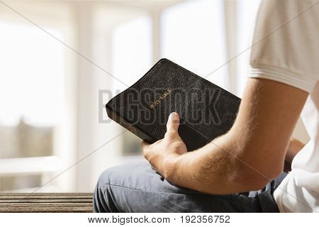 Man book bible green background paper human