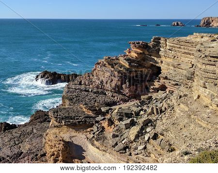 Bird's eye view of rock formations and ocean waves