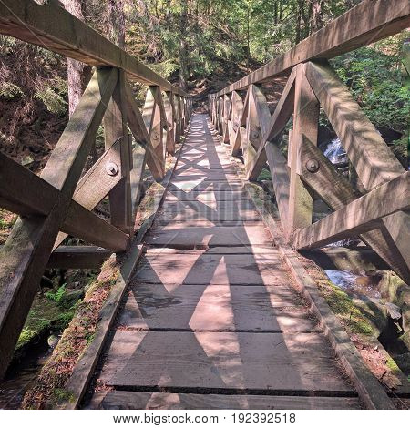 Geometric patterns on old bridge with shadows for journey crossing concept