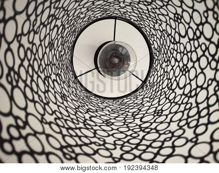 Light bulb in an simple round iron chandelier