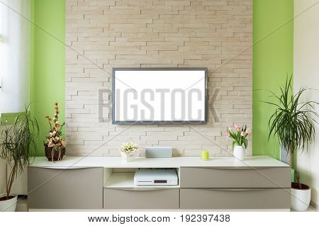 Modern living room interior - tv mounted on brick wall with white screen.