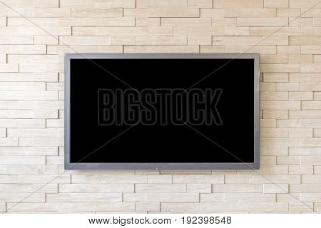 TV display on modern brick wall background with black screen.