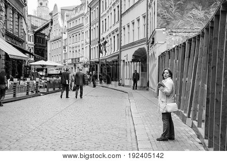 Tourists On Tirgonu Iela Street In Old Riga Town