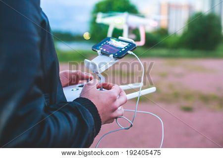 A process of launching the quadcopter drone with camera, operator pilot launches quadcopter uav, unmanned aerial vehicle flying