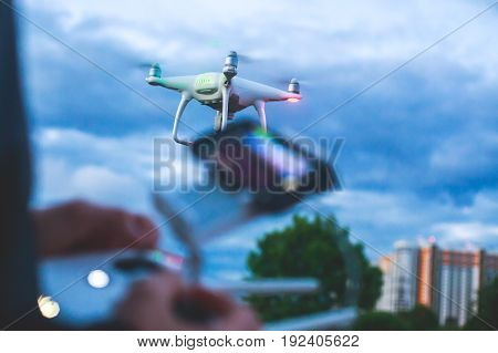 A process of launching the quadcopter drone with camera, operator pilot launches quadcopter uav, unmanned aerial vehicle flying