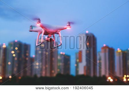 A process of launching the quadcopter drone with camera, operator pilot launches quadcopter uav, unmanned aerial vehicle flying