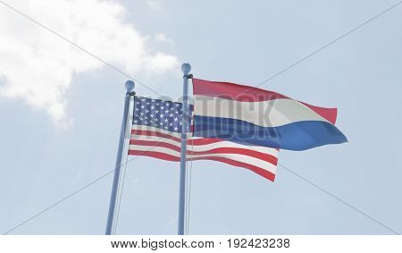 USA and Netherlands, two flags waving against blue sky. 3d illustration