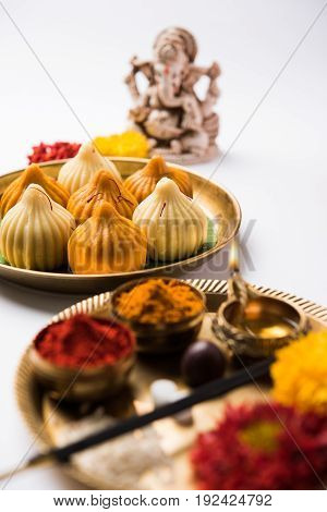 A modak is an Indian sweet dumpling popular in many parts of India. It is called modak in Marathi and Konkani as well as Gujarati language, Kozhakkatta in Malayalam, modhaka or kadubu in Kannada