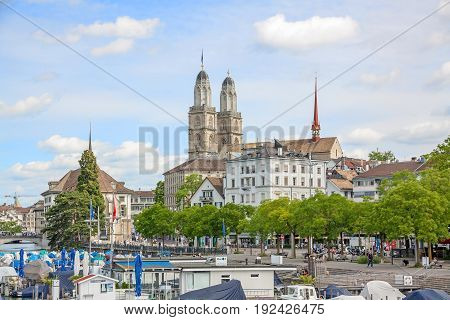 Zurich Switzerland - June 10 2017: Minster Grossmunster view from Quaibrucke bridge river Limmat in front.