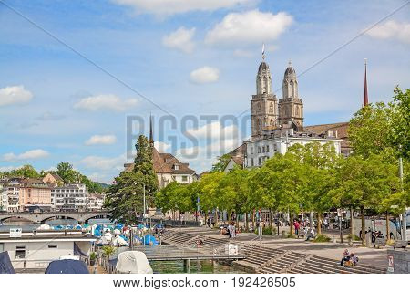 Zurich Switzerland - June 10 2017: Minster Grossmunster view from Quaibrucke bridge river Limmat in front.