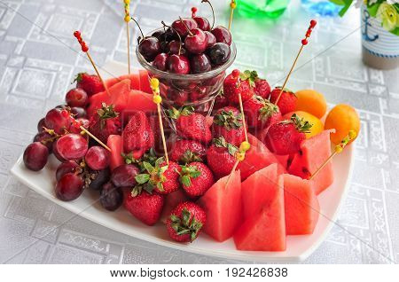 Mixed Fruit platter with assorted fruits on a white background