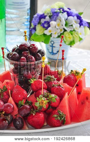 Mixed Fruit platter with assorted fruits on a white background