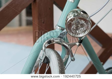 retro vintage bicycle headlight closeup. green bicycle