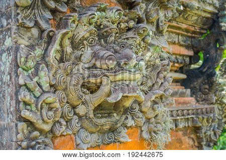 BALI, INDONESIA - MARCH 05, 2017: Stoned statue in the enter of Pura Ulun Danu Bratan temple on Bali island, Indonesia.