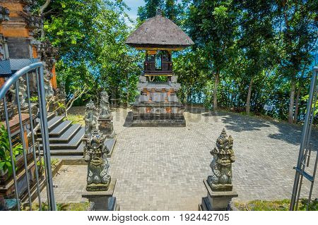 BALI, INDONESIA - MARCH 05, 2017: Stoned statues in the enter of Pura Ulun Danu Bratan is a major Shivaite and water temple on Bali island, Indonesia.