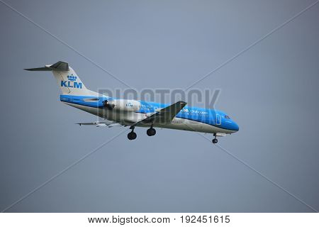 Amsterdam the Netherlands - June 22nd 2017: PH-KZP KLM Cityhopper Fokker F70 approaching Polderbaan runway at Schiphol Amsterdam Airport the Netherlands