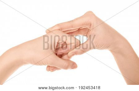 Hands of woman suffering from pain in joints on white background. Concept of orthopedist attendance