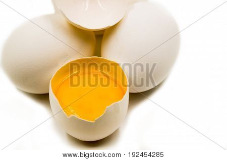 fresh eggs with yellow yalk on the black background
