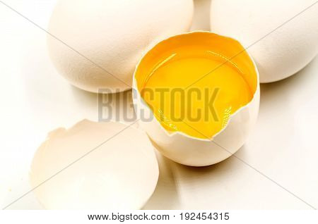 fresh eggs with yellow yalk on the black background