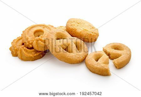 Butter cookies isolated on white background have one broken piece.