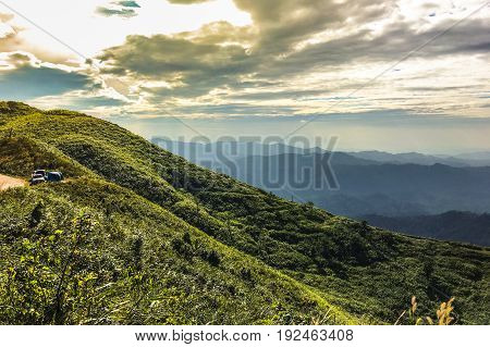 Landscape on hilltop with clouds sunlight in summer season