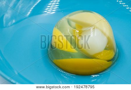 fruit various jelly mix on a blue plate