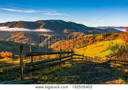 Wooden Fence By The Road In Rural Area